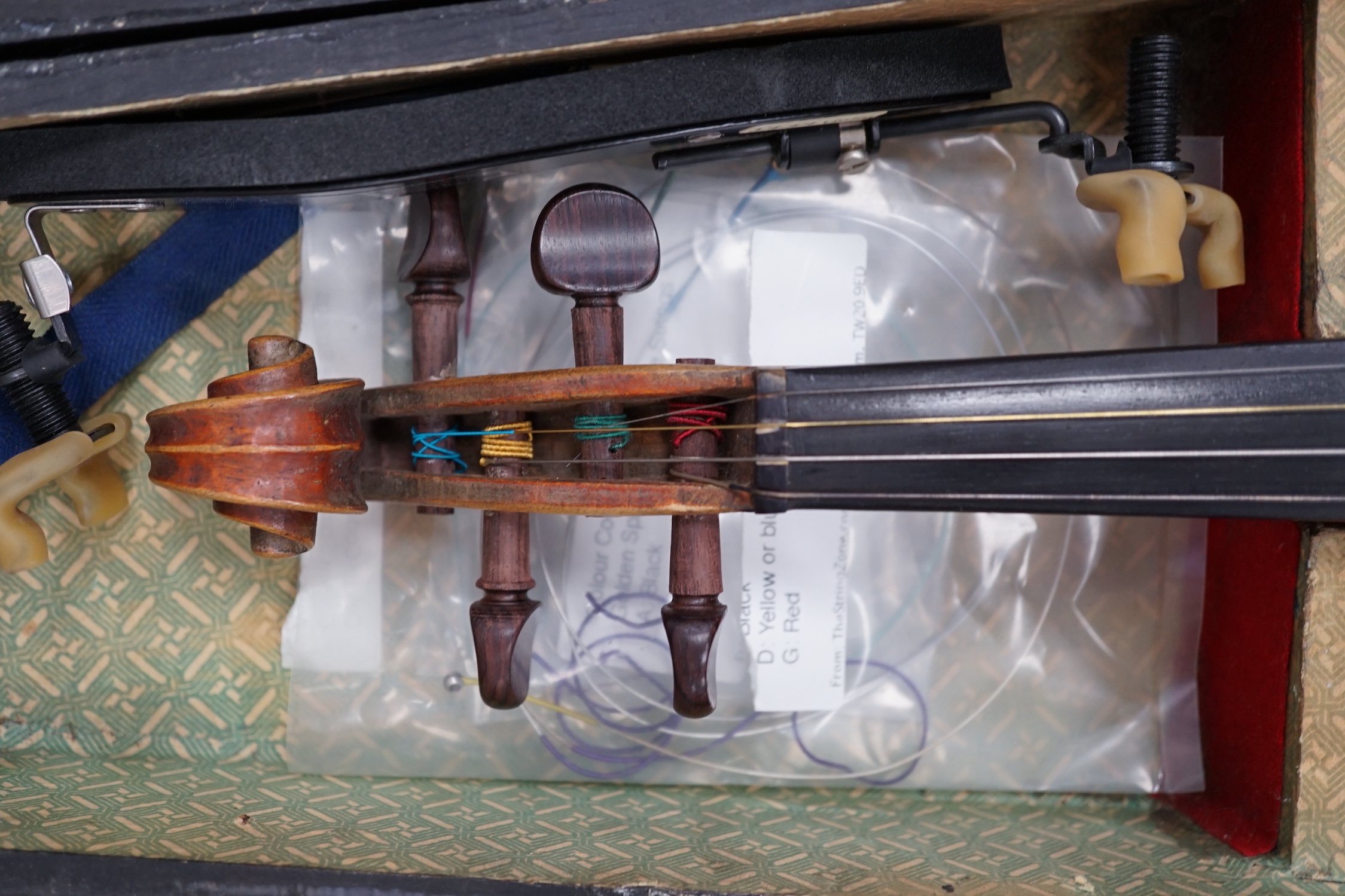 A mid 19th century cased French violin, length of body 35.5cm, with bow, simulated ivory tip